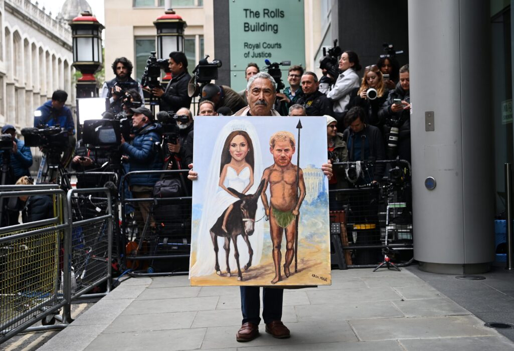 London (United Kingdom), 06/06/2023.- Political satire artist Kaya Mar holds his painting showing Britain
